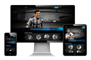 Foto exibindo aparência do site da OTB em tablet, celular e desktop.
